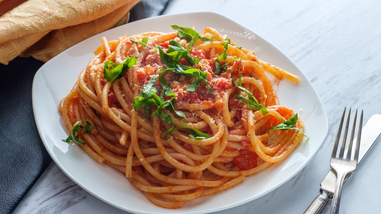 Plate of pasta with utensils