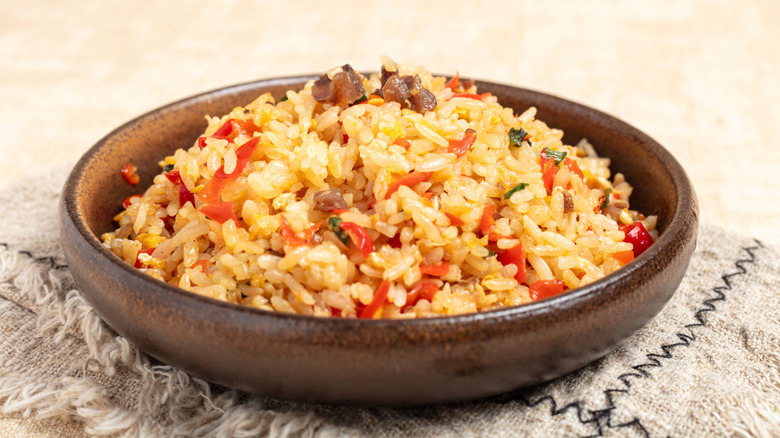 Beef fried rice in a wooden bowl
