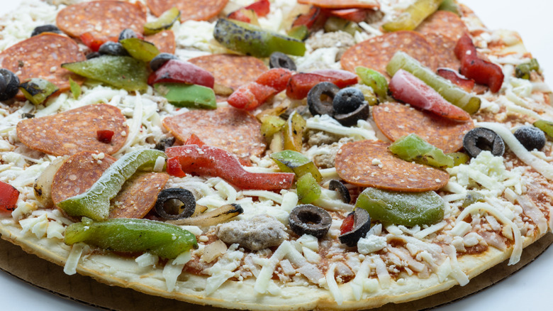 Frozen pizza with veggies and pepperoni