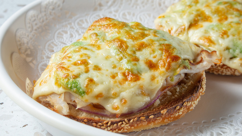 Bagel with melted cheese and toppings