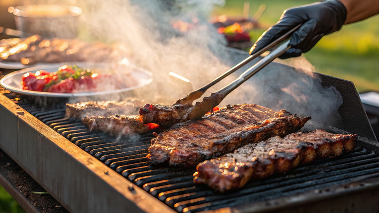Person cooking food on a grill