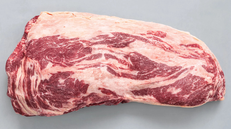 Beef brisket on neutral background