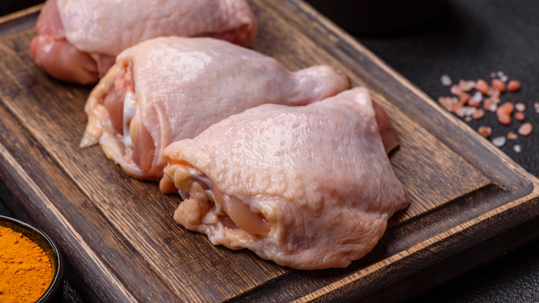 Chicken thighs on a cutting board