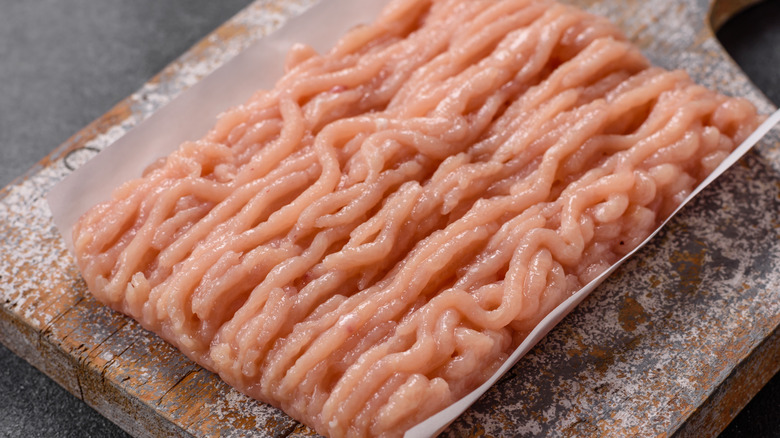 Ground chicken on a piece of parchment paper