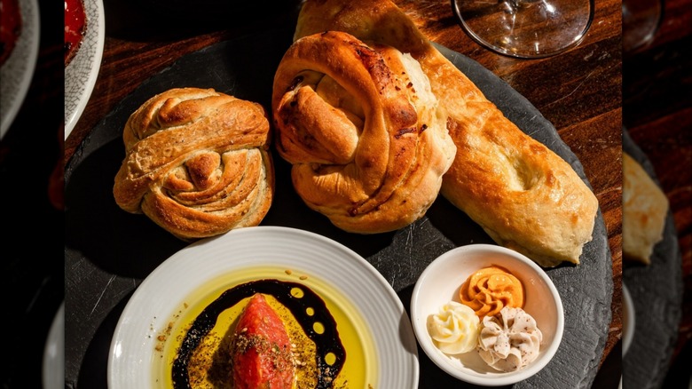 A variety of breads with butter and olive oil at Doris Metropolitan