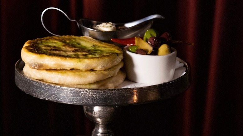 Grilled focaccia with olives and ricotta at Marcel