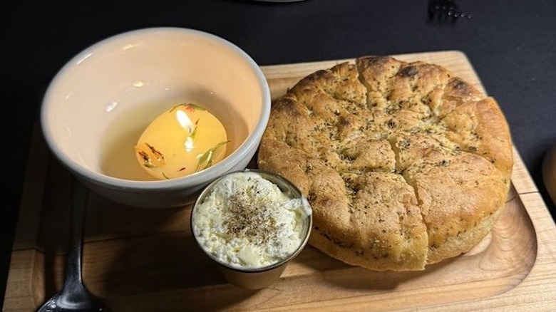 The Rosemary Focaccia with a beef tallow candle at The Butcher and the Bear