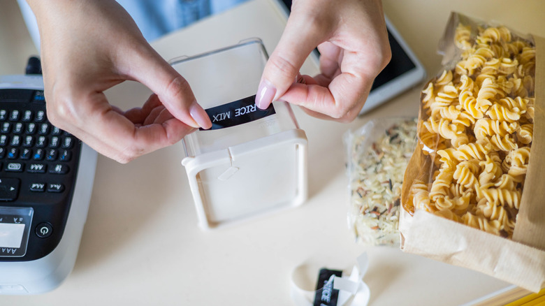 woman labeling kitchen ingredients