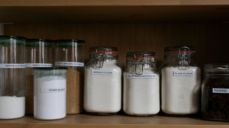 glass jars of baking supplies with fitted lids