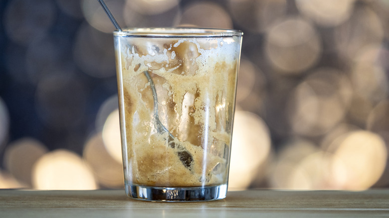 Cookie dough-inspired dirty soda drink in a glass