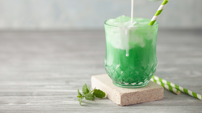 Minty grasshopper-inspired dirty soda in glass cup