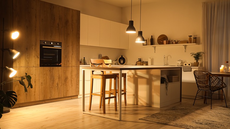 warm lighting over kitchen island