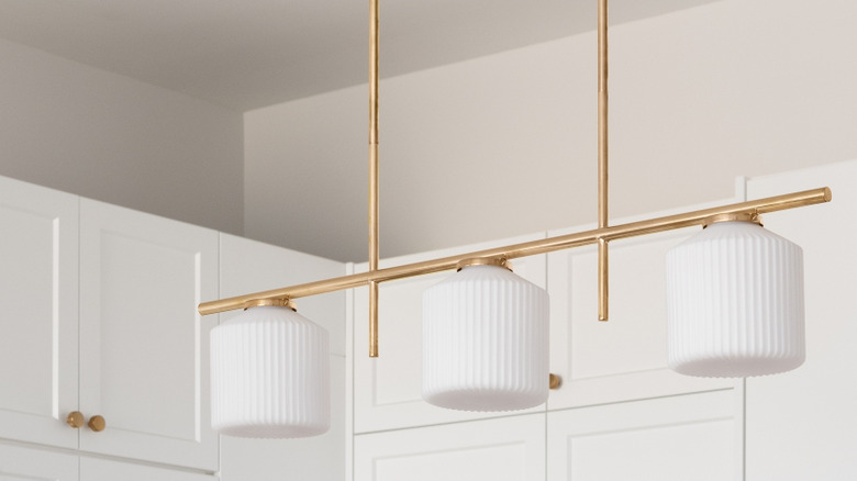 white kitchen cabinets with rose gold hardware