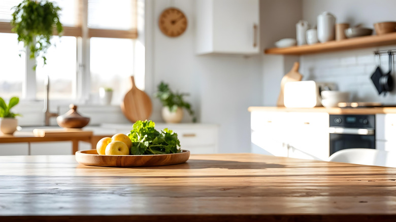 clean kitchen island with fruits and vegetables