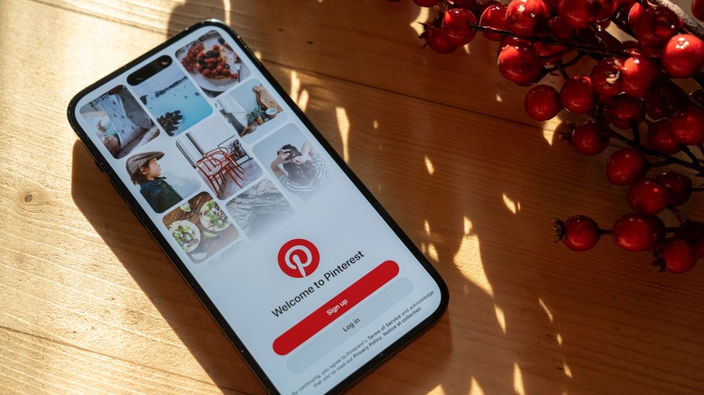 phone showing Pinterest on shadowed counter