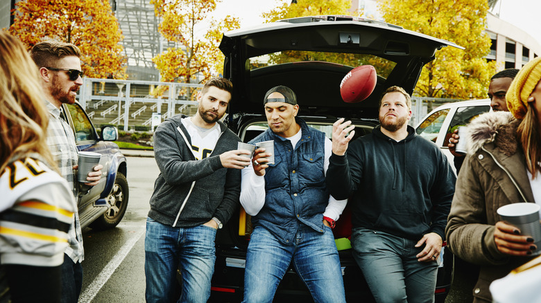 People hanging out at football tailgate