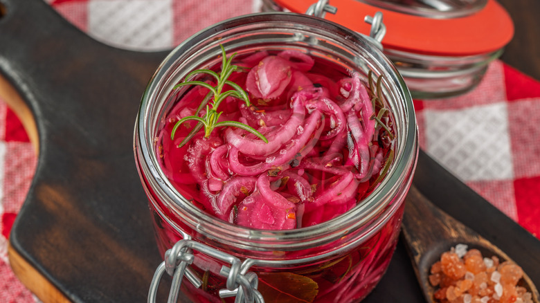 Pickled red onions in a jar