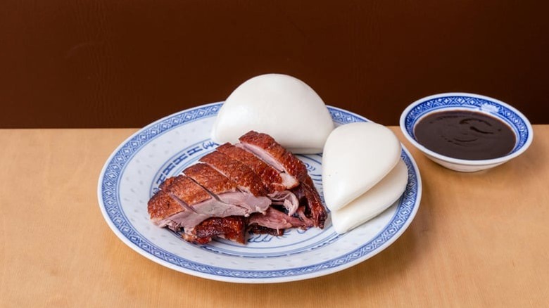 The tea smoked ducked from Birds of a Feather with steam buns and a dipping sauce