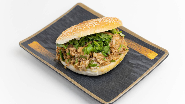 A sesame bun stuffed full of meat and herbs from Super Taste