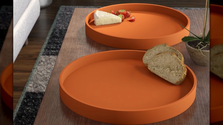 Orange plate with bread on it
