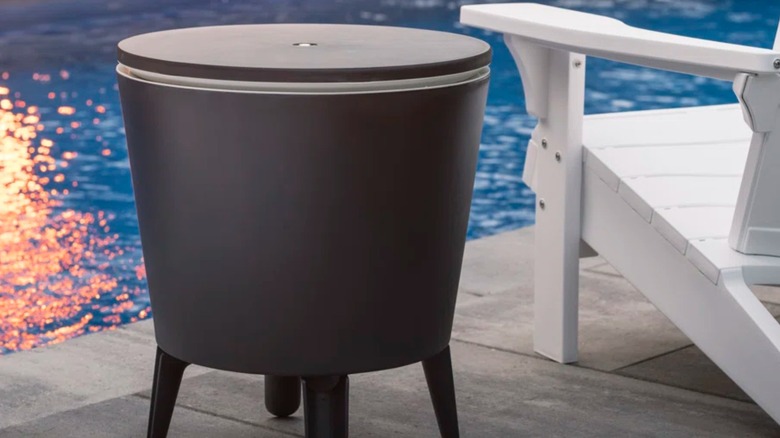 Cooler table next to chair