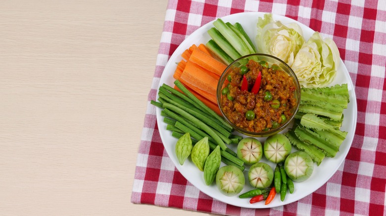 A bowl of prahok ktis with vegetables