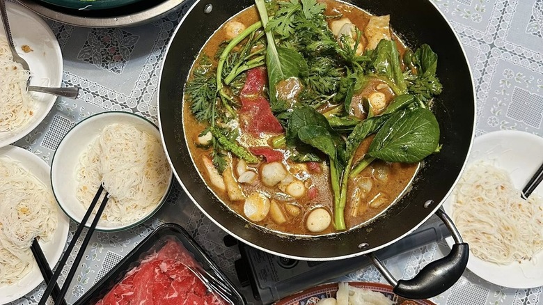 A pot of Cambodian hot pot soup called ya hon
