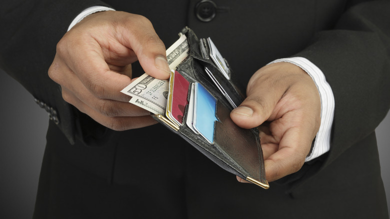 Person holding wallet with cards