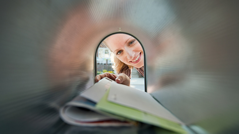 Person checking a mailbox