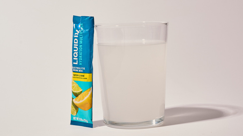 Lemon Lime Liquid I.V. next to a glass of water