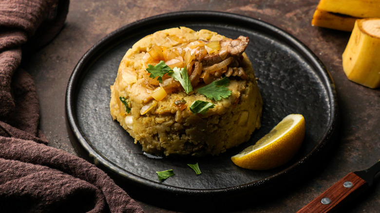 Mofongo on a black plate