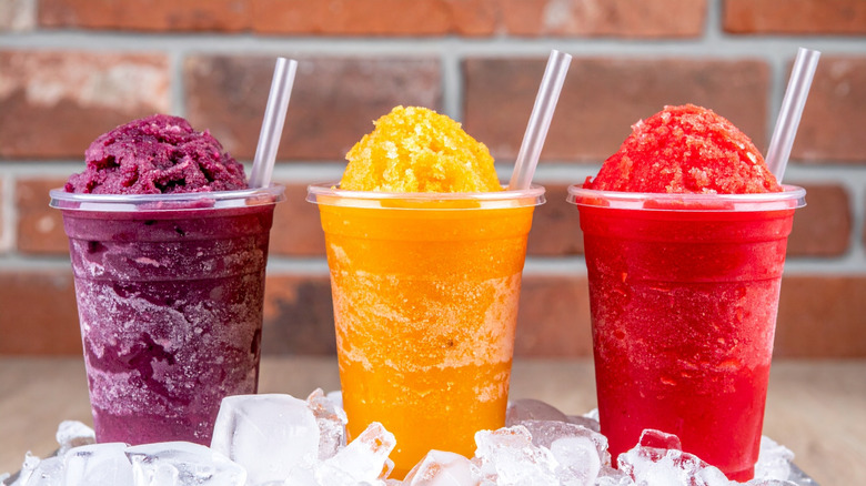 Three plastic cups of shaved ice