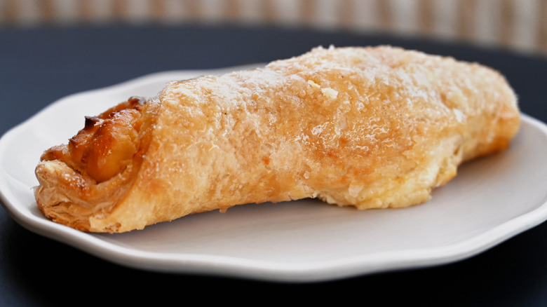 Quesito (puff pastry stuffed with cream cheese) on a white plate