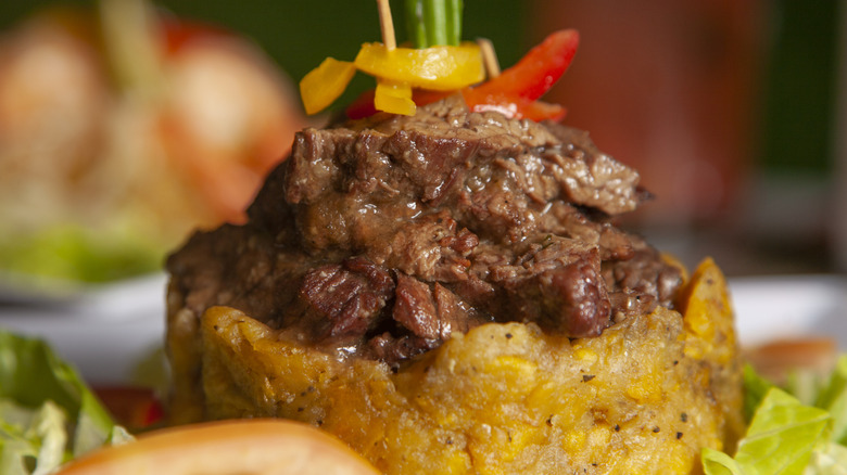 Trifongo topped with stewed beef