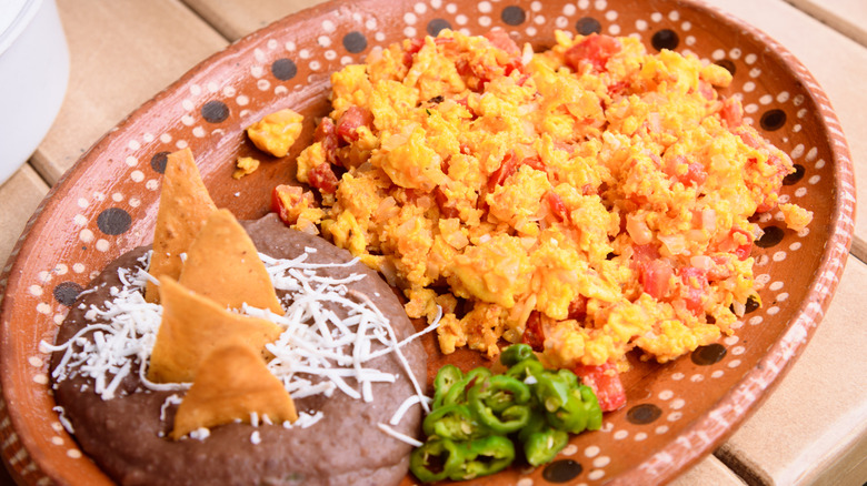 A plate of Huevos a la Mexicana on a table
