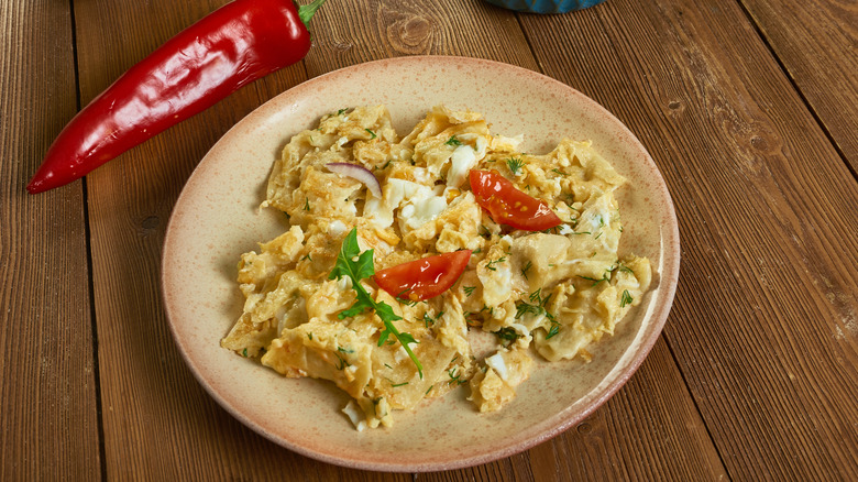 A plate of matzo brei on a table