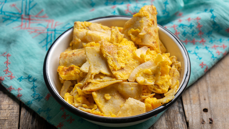 A bowl of Mexican migas on a table