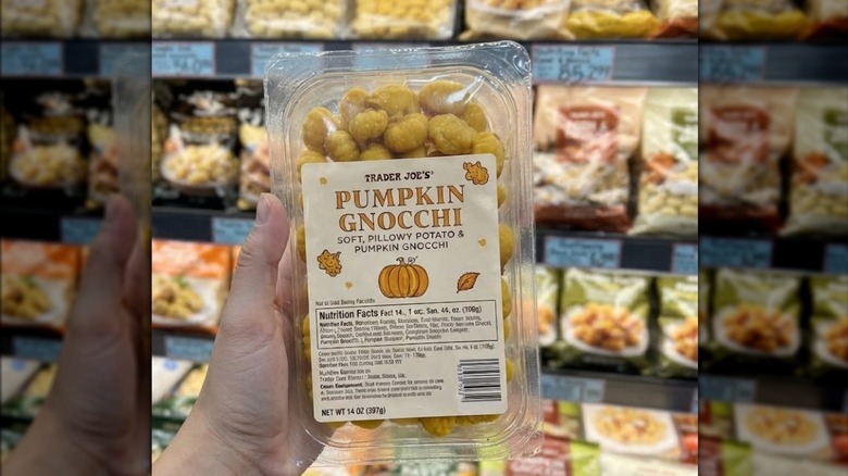 Person's hand holding Trader Joe's Pumpkin Gnocchi