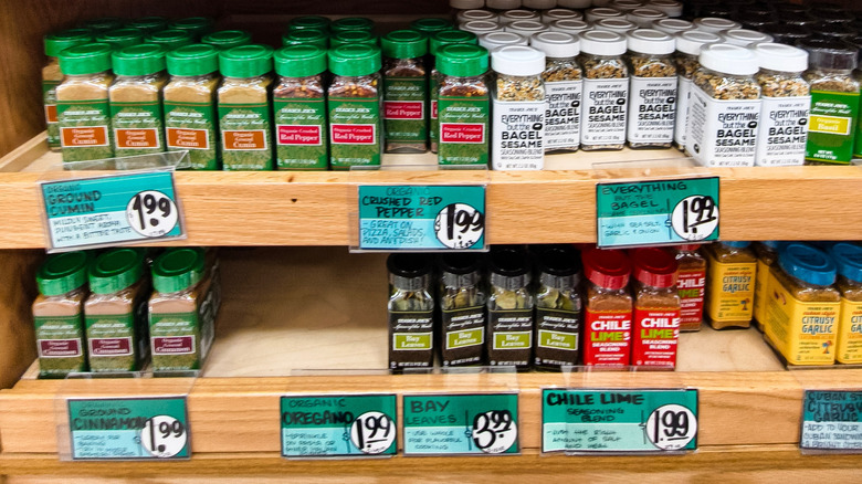 Various Trader joes spices and seasoning blends in store on shelves.