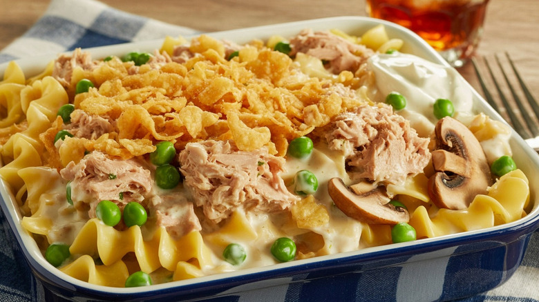 Tuna noodle casserole with mushrooms in blue baking dish