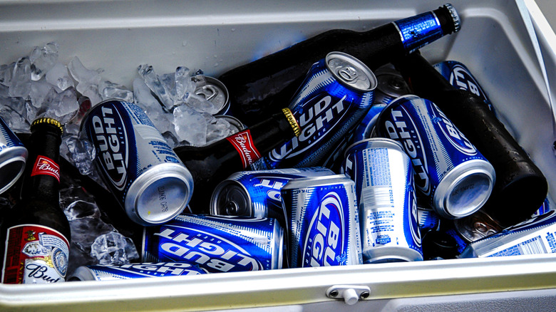 Cans and bottles of Bud Light in a cooler