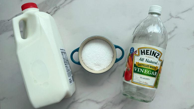 milk salt and sugar on marble counter