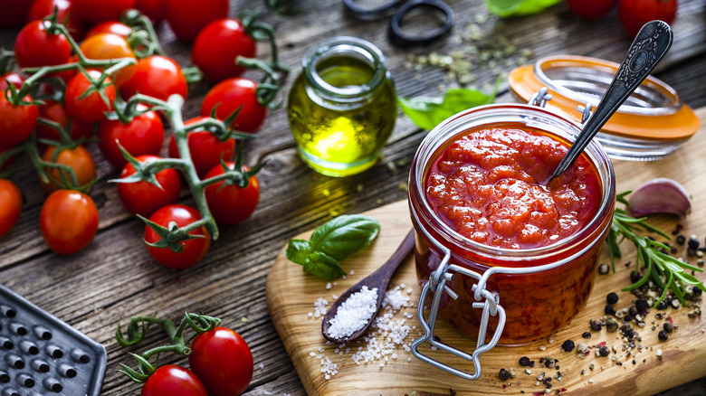 Italian ingredients are on display on a wood table.