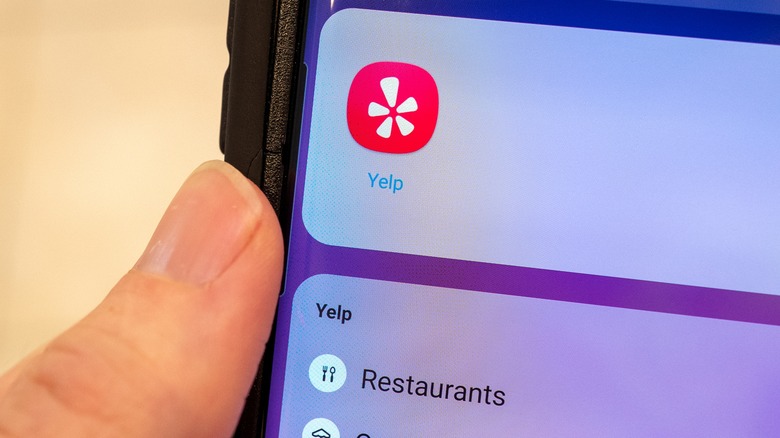 Phone with Yelp app
