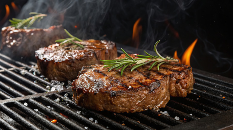 Steaks searing on the grill