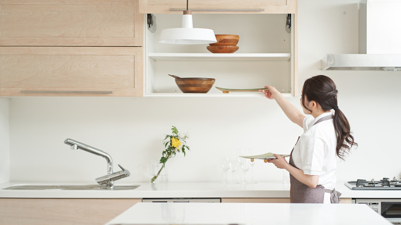 woman organizing the kitchen