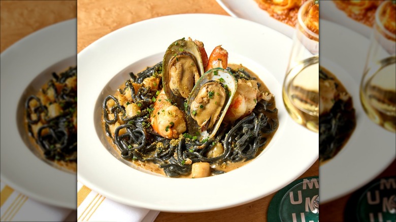 Bowl of squid ink pasta with clams