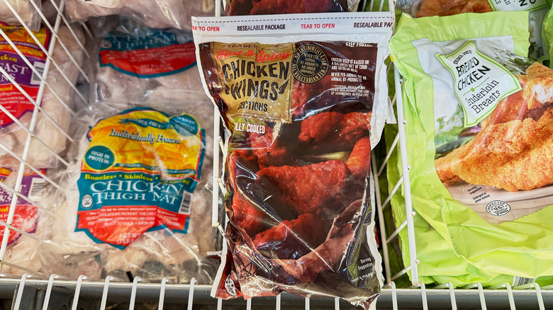 Packages of chicken wing sections in the freezer aisle at Trader Joe's
