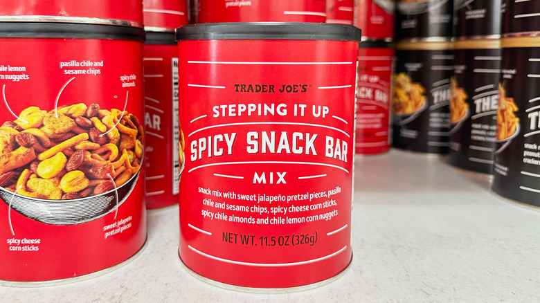 Containers of spicy snack mix on a shelf at Trader Joe's