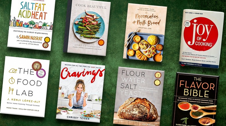 Eight cookbooks on a green background